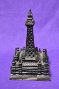 A vintage cast penny bank modelled as Blackpool tower