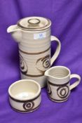 Three pieces of Abaty Stoneware studio pottery, to comprise a lidded coffee pot, a milk jug, and