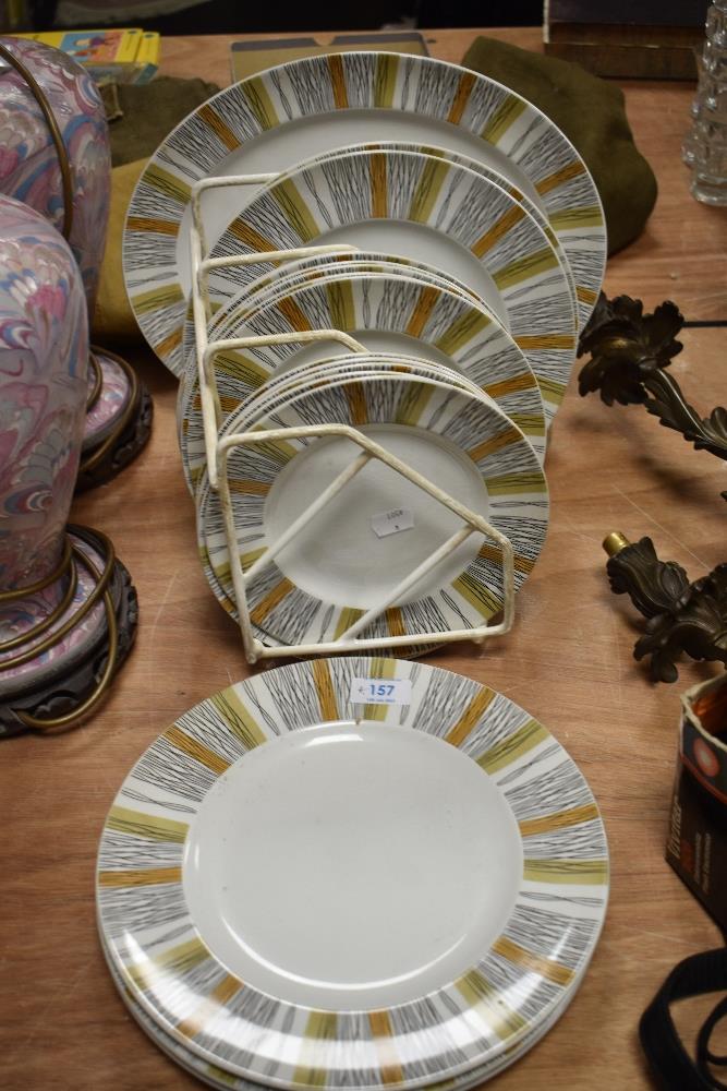 Seventeen mid centruy Midwinter 'Sienna' plates and a platter.