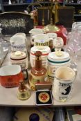 A collection of advertising jugs etc, including Jennings, Bass, Bells and Haig, some AF.