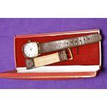 A vintage gold plated wristwatch by Tavannes having white enamel face having arabic dial with