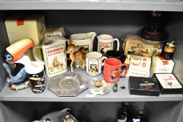 A collection of Guinness memorabilia including George V LNER buffet piece and pin badges