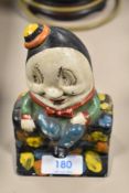 A 1920s cast metal painted money box in the form of Humpty Dumpty.