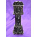 A cast metal penny bank, modelled as long case clock