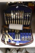 An early 20th century mahogany canteen containing plated knives and forks with bone handles and