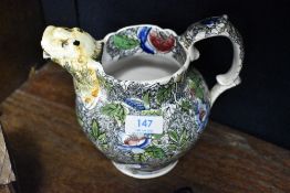 A 19th Century jug having transfer print and animalistic spout, af