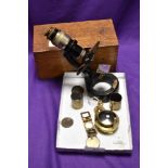 An Antique microscope, by C Baker, with brass plaque, number 18078, with various attachments and