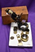 An Antique microscope, by C Baker, with brass plaque, number 18078, with various attachments and