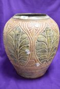 A decorative Grecian style stoneware vase having mottled tones, height approx. 35cm