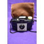 A vintage Kodak Brownie 127 camera and case