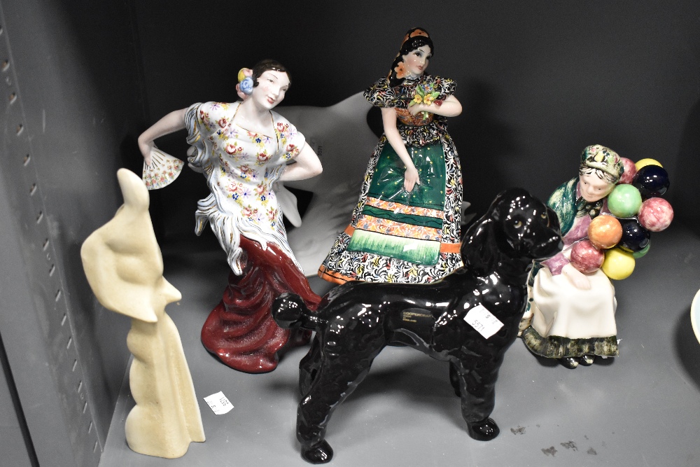 A collection of decorative figures including Coopercraft and Canadian Balloon lady