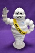 A cast metal advertising penny bank, Michelin man, height approx. 22cm
