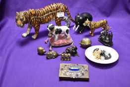 A selection of collectable trinkets etc including encrusted tiger, brass nut shell, heredities style