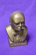 A brass bust of small proportions, modelled after Winston S Churchill