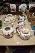 Seven antique teapots, including 18th century porcelain, two Japanese examples and similar.