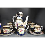 A late 19th or early 20th Century coffee set comprising coffee pot (lid damaged) , cream jug and six