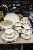 A selection of Royal Doulton 'Melissa' table ware, cups, saucers, platter and serving bowls