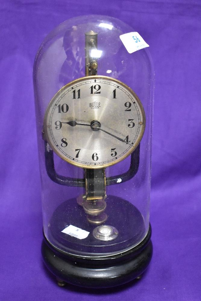 An early 20th Century Bulle electromagnetic clock having silver arabic dial, on ebonised base,