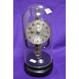 An early 20th Century Bulle electromagnetic clock having silver arabic dial, on ebonised base,