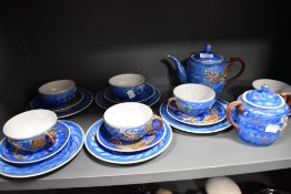 A Japanese eggshell tea set having transparent lithopane 'Geisha girl' to base