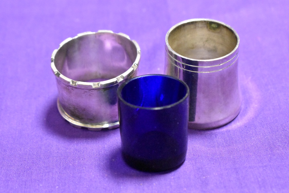 A John Rose of Birmingham silver napkin ring with engraved initials and a white metal salt with blue - Image 2 of 3
