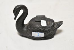 A 19th Century spelter money bank, in the form of a swan, the body with hinged lid, and measuring