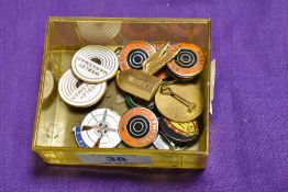 A small collection of enamelled Webley, BSA, and other pin badges