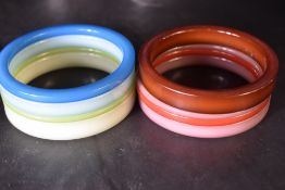 Two sets of Danish 1960's plastic bangles by Ketty Dalsgaard for Buch & Deichmann, in shades of blue