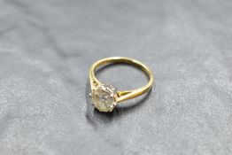 A diamond solitaire ring, approx 1.5ct in a claw set raised mount to knife blade shoulders on an