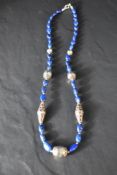 A lapis lazuli and silver bead necklace, approx 22'