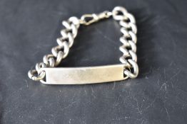 A gent's silver identity bracelet bearing worn monogram, approx 47.2g
