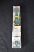 A Swatch 'Nautilus' wristwatch circa 1986, with plastic case, original sales receipt and guarantee