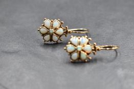 A pair of 9ct gold antique style opal drop earrings on loop drops, approx 3.3g gross