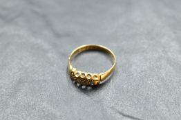 An Edwardian diamond chip set ring having a moulded mount on an 18ct gold loop, size T & approx 2.