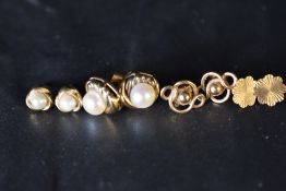 Four pairs of 9ct gold stud earrings including pearl,approx 7.8g gross, missing several butterfly