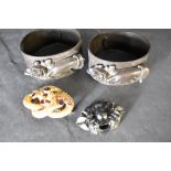 Two early flexible celluloid mourning bangles having moulded hand and rose decoration and a