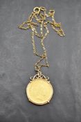 A 10 Guilders (Gulden) Netherlands gold coin in a removable gold mount on a 9ct gold chain, approx