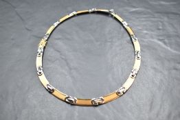 An Italian 750 grade diamond set white and yellow metal necklace, the five link connectors set
