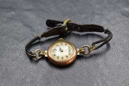 A lady's vintage 9ct rose gold wrist watch having Arabic numeral dial with subsidiary seconds in a