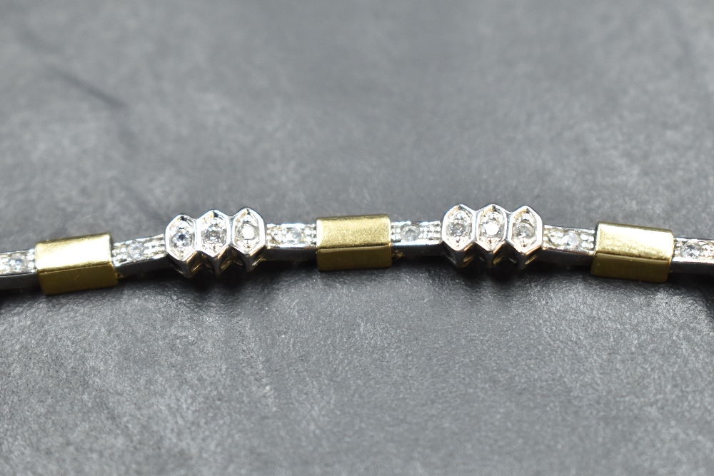 An 18ct white and yellow gold articulated bracelet having eight diamond set panels, 40 stones - Image 2 of 2