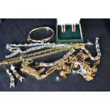 A small selection of gold plated jewellery including hinged bangle, necklaces, Grosse earrings,
