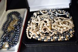 A selection of costume simulated pearl jewellery including brooch, necklaces, pendant, earrings etc