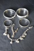 Two HM silver hinged bangles, two baby's silver Christening bangles, a child's silver bracelet and a