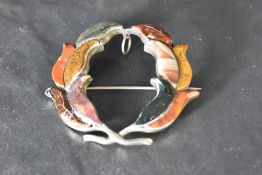 A Victorian Scottish mixed agate and silver brooch having a silver back