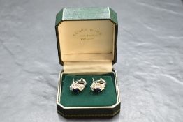 A pair of 18ct white gold sapphire and diamond earrings having oval sapphires, each approx 1.1ct