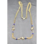 An Italian 14k yellow metal and lapis lazuli dolphin design double chain necklace, marked 585 *510