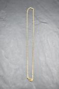 A yellow metal chain with barrel clasp, presumed gold, approx 17' & 5g