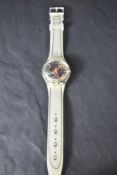 A 1993 Swatch 'Scribble' wristwatch with certificate of authenticity and original card packaging,