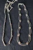A silver double link chain having box clasp, approx 16' and a white metal chain having moulded