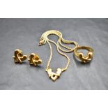 An 18ct gold three piece jewellery suite by Boodle & Dunthorne in the 1990's Hug design,